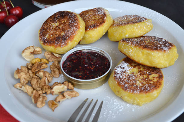 istock Next to the cheese pancakes are walnuts, jam and cherries 1503393158