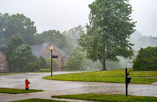 Thunderstorm and heavy rain falling on residential area