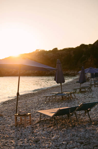 istock sunset on the beach. beach with pebbles, sunset 1503394245