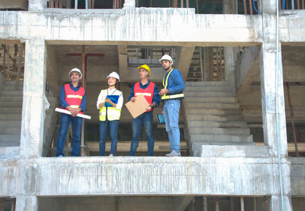 istock engineer teams wearing full safety gear while working on height dangerous construction sites 1503395974