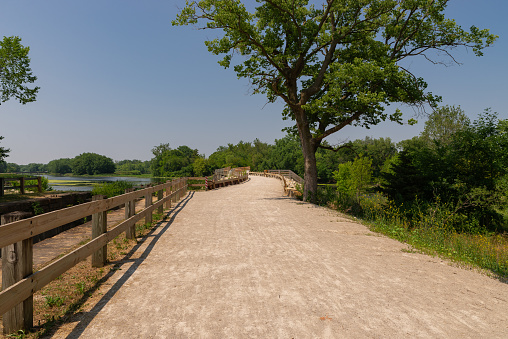 Bike path and trail at Channahon State Park on a sunny Summer afternoon. Channahon, Illinois, USA.