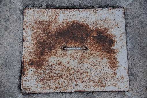 simple concrete sewage cover on a street in close up