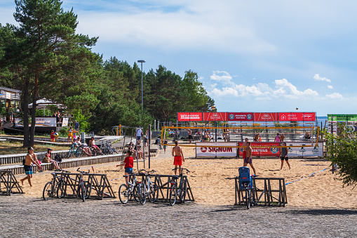 Saulkrasti, Latvija - June 25, 2023: People play volleyball on the beach