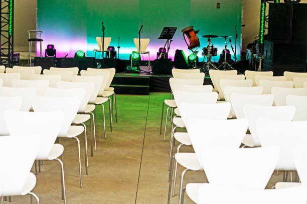 concert music stage before performance with white chairs. horizontal