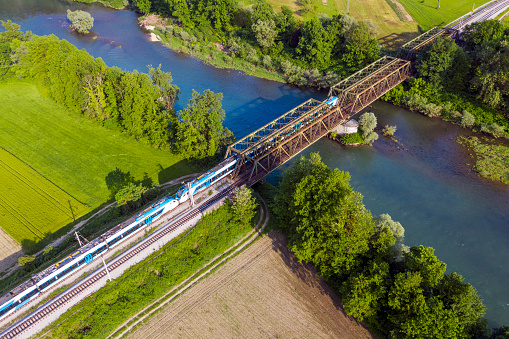 Arial view on train on the bridge.