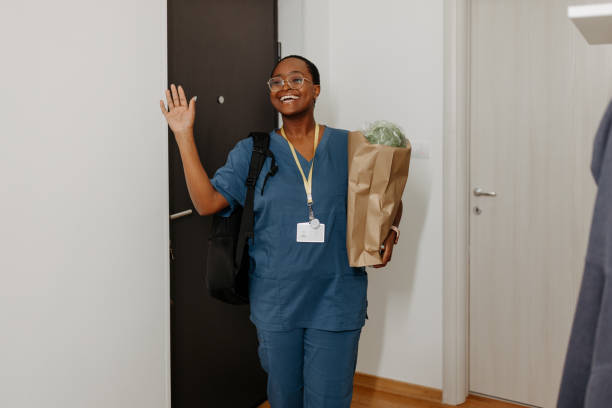istock Cheerful nurse entering her home 1503419083