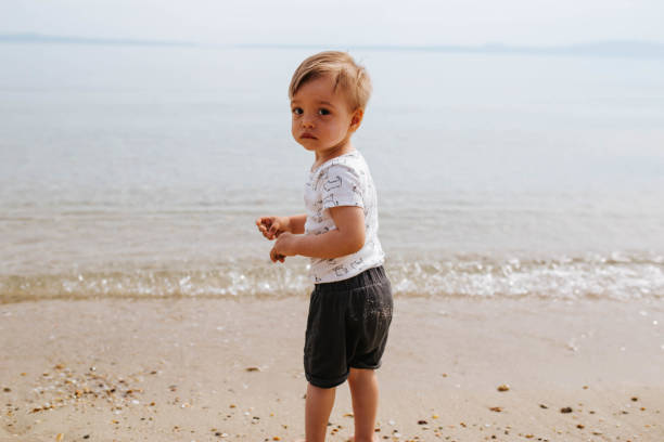 istock Baby boy  at the beach 1503421308