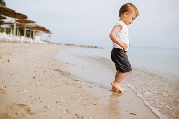 istock Baby boy  at the beach 1503421893