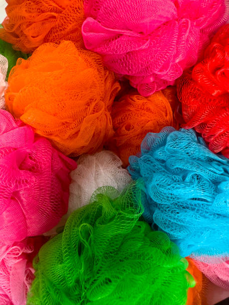 Multi colour shower sponges stock photo