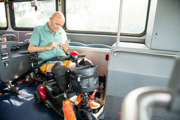 istock A disabled senior man rides the bus on a mobility scooter 1503443457