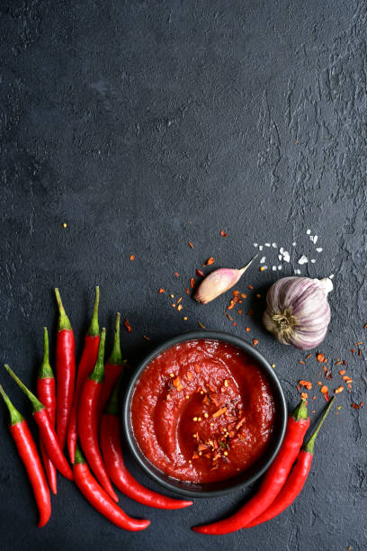 istock Spicy asian dip harissa with roasted red pepper and garlic.Top view with copy space. 1503445934