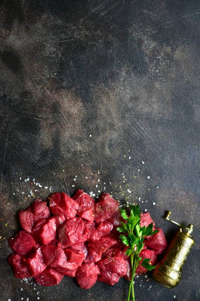 istock Raw organic meat ( beef or lamb ) . Top view with copy space. 1503448605