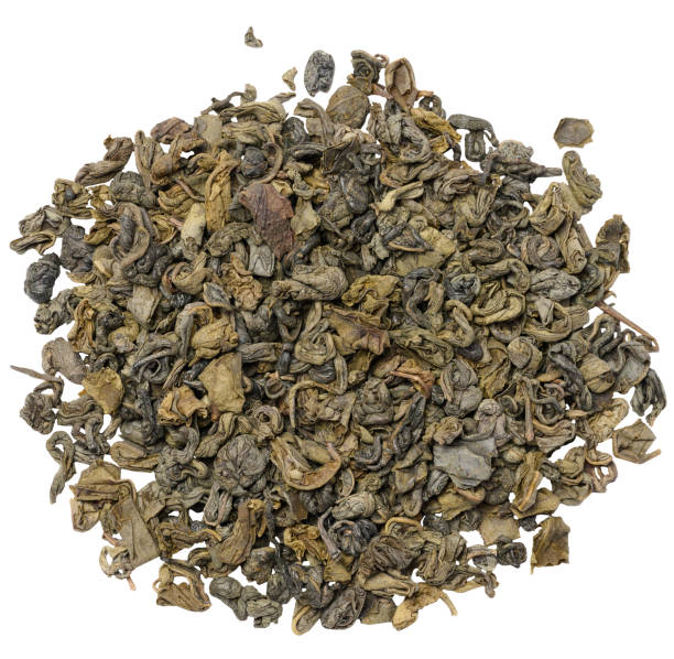 istock Twisted dry green tea leaves, healthy drink 1503449904