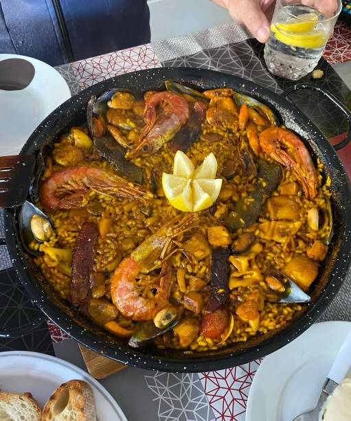 istock Classic dish of Spain, seafood paella on the kitchen table 1503450821