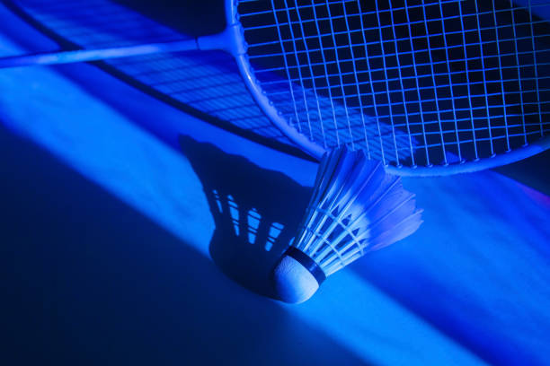istock Badminton racket and shuttlecock in vibrant bold gradient holographic neon colors. Horizontal sport theme poster, greeting cards, headers, website and app 1503466063