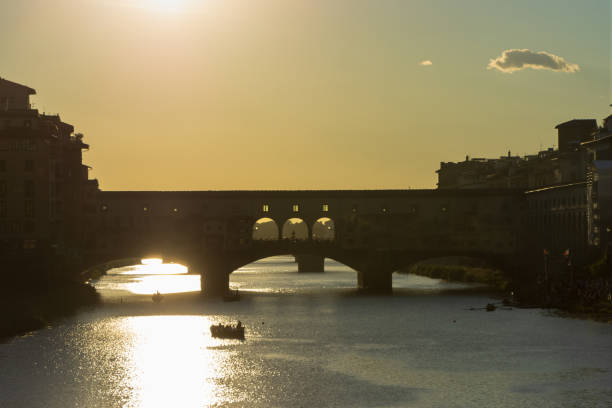 istock Silhoutte view of the iconic Ponte Vecchio and Arno River, Florence 1503479332