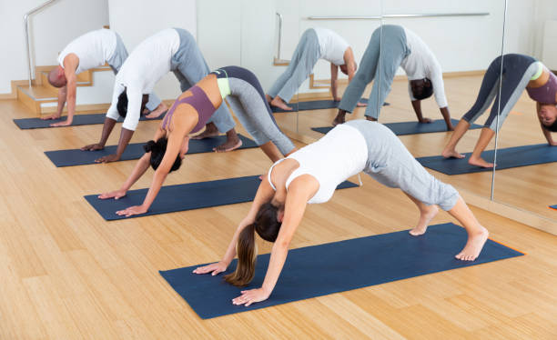 istock Multiethnic group of young people practicing yoga 1503493087