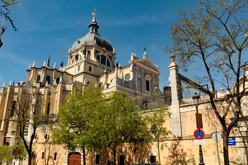 Facade of the Cathedral of Santa Maria a Real de Almudena and the Museum of the Almudena Cathedral, in the historic center of the city of Madrid