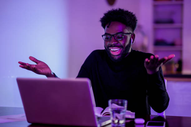 istock A multiracial remote worker is sitting at home at night and having a video call with superiors while explaining a project. 1503534299