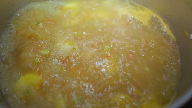 Close-up of boiling fish stew or sancocho in a big cooking pan