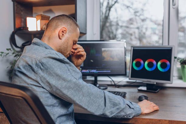 istock Tired and overworked man working on computer at home office 1503534669