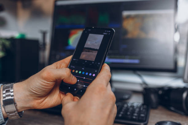 Social media content creator editing video on smart phone