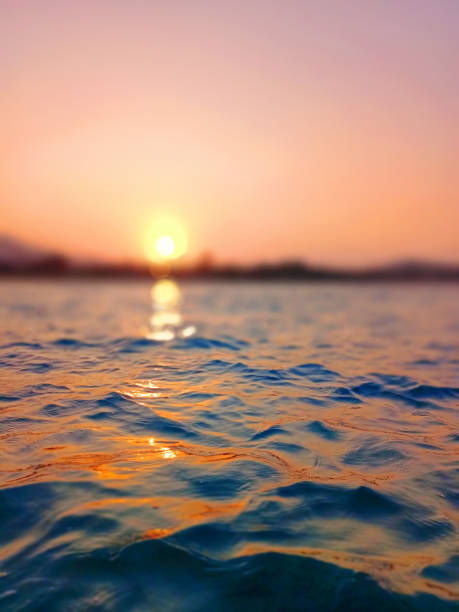 istock Sea wave splash, sunset blurred bokeh background, ocean water surf ripple texture, sunrise soft focus, tropical island beach dawn, sundown orange sun shine reflection, summer holiday, vacation, travel 1503619808