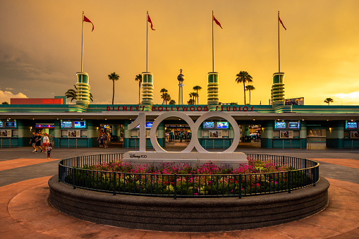 Walt Disney World's Hollywood Studio main entrance in Orlando, Florida with the 100 year celebration sign.