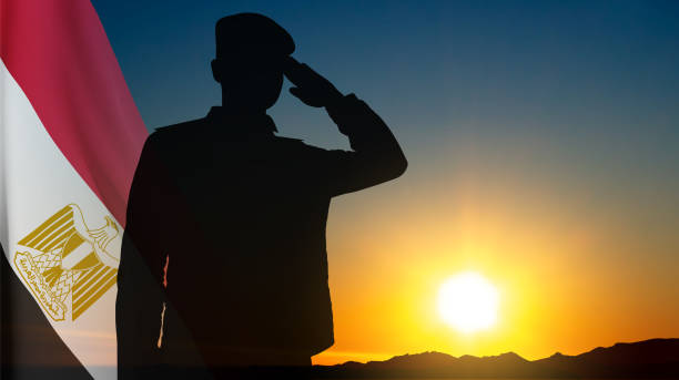 istock Silhouette of saluting soldier with Egypt flag against the sunset 1503661889