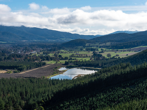 Looking down on rural valley and pondage in the Victorian High Country