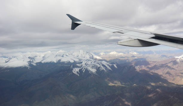 istock View from airplane to mountains and clouds 1503677519