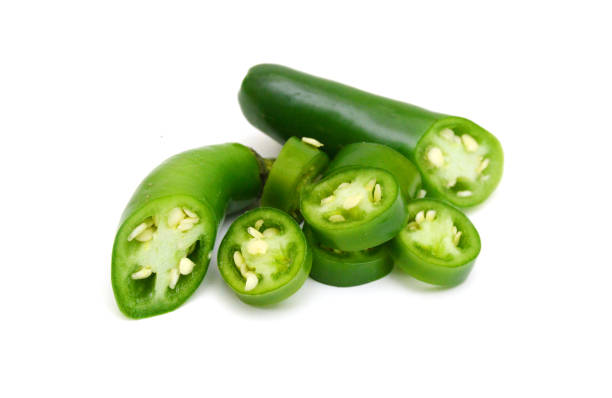 istock Fresh green cut chili pepper pieces on a white background 1503687184