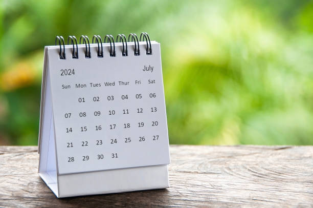 istock July 2024 white table calendar with customizable space for text. Calendar and copy space concept 1503705892