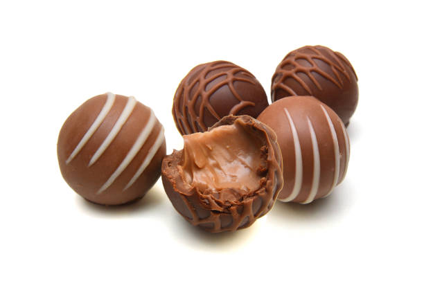 istock Chocolate candies collection. Beautiful Belgian truffles isolated on white background 1503706340