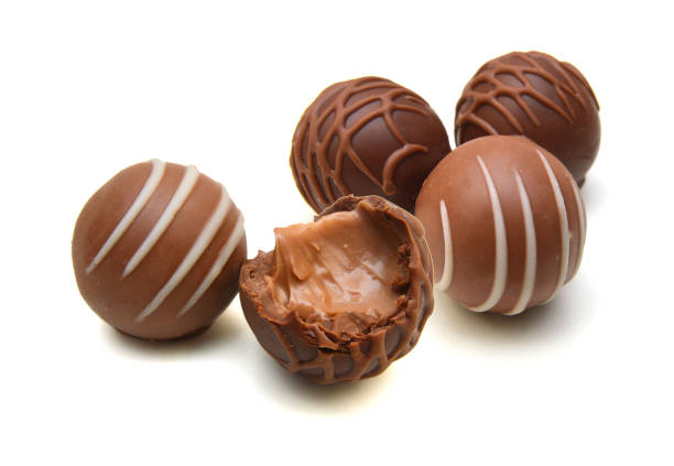 istock Chocolate candies collection. Beautiful Belgian truffles isolated on white background 1503707535