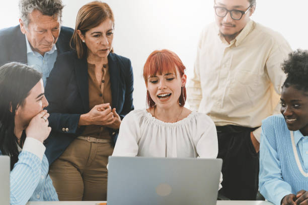 istock Young woman presenting project to diverse colleagues in office 1503708829