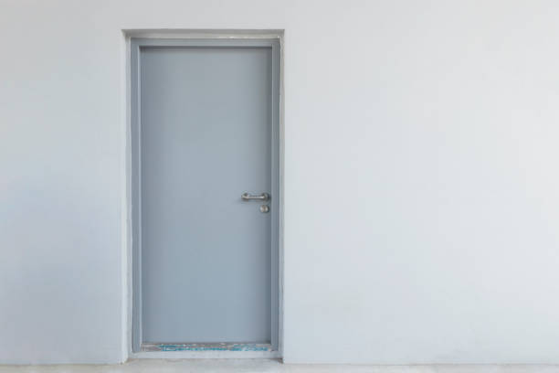 istock steel door on grey wall background 1503721275