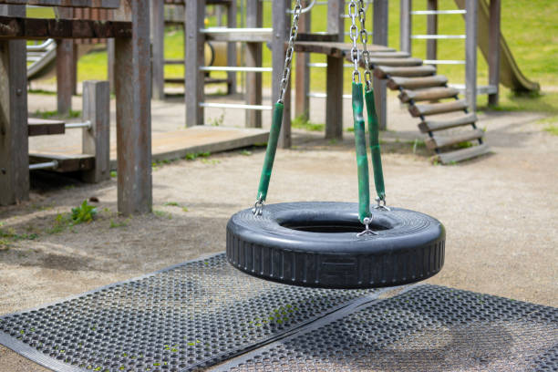 Close up of tire Swing in Park at Autumn.