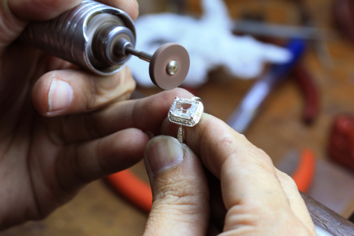 Close up of repairing ring by polishing motors tool