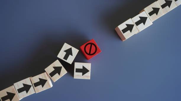 istock Wooden blocks with arrow and stop icon. 1503752196