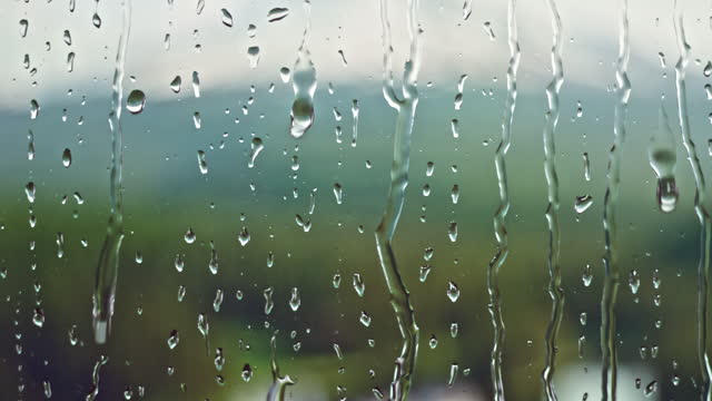 LD Rain on a window in the countryside