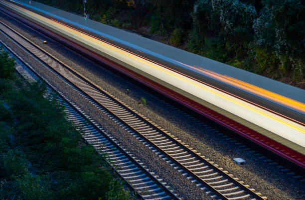 High angle view of blurred motion subway train at night, Berlin Wilmersdorf