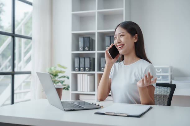 istock Young Asian woman university student satisfied with learning english language during online courses via laptop computer, learning online with webinar, video tutorial, internet lessons 1503761311