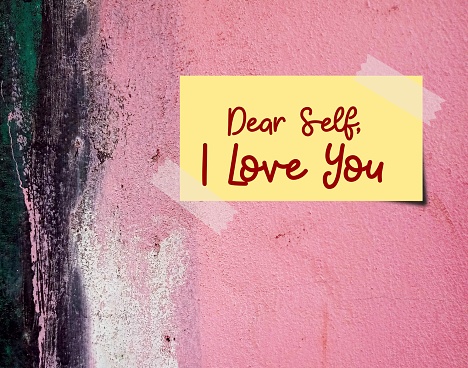 Stick note on pink grunge vintage wall with text written DEAR SELF, I LOVE YOU to build up self esteem, respect and acceptance, accept imperfection just the way it is than seeking approval from others