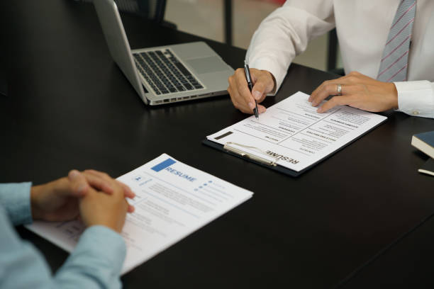 istock Examiner reading a resume during job interview at office Business and human resources concept. 1503809112