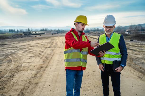 istock Engineer and investor on a road construction site 1503821456