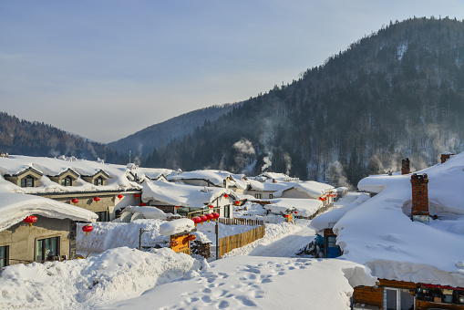 Mohe, China - Feb 25, 2018. Wooden houses at snow village in Mohe County, Northernmost China.
