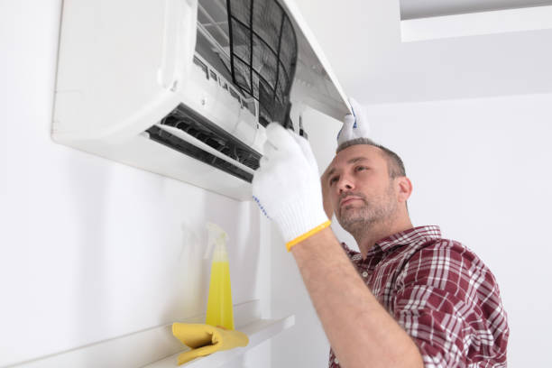 istock Service guy cleaning and maintaining air condition unit. 1503857348