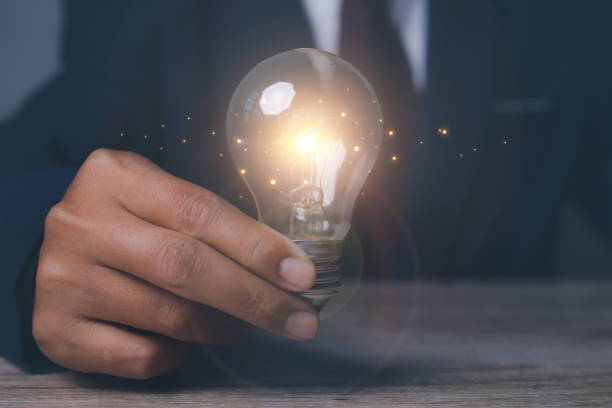 istock Man holding light bulbs the new ideas with innovation technology and creative. Business, Development, Concept creativity with bulbs that shine glitter. 1503860714