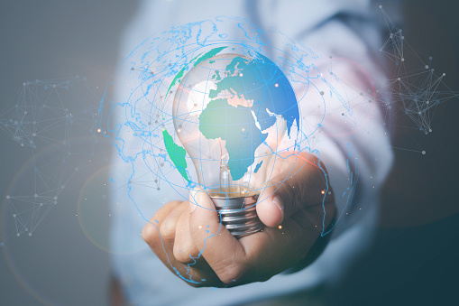 Hand of businessman holding light bulb with network connection line, idea, innovation and inspiration. Digital marketing global network and data exchanges over the world.